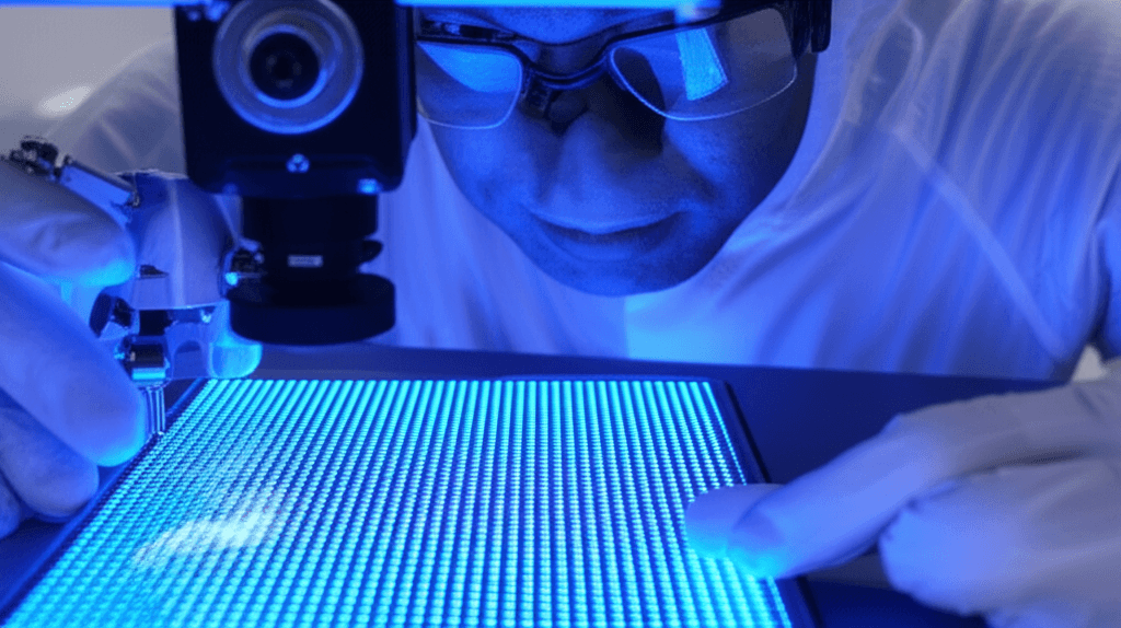 Close-up image of a microchip with glowing nanoscale LEDs.